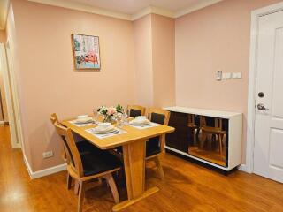 Cozy dining area with wooden table and chairs