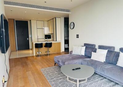 Modern living room with open kitchen and seating area