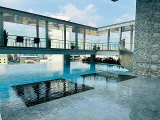 Outdoor pool area with city view