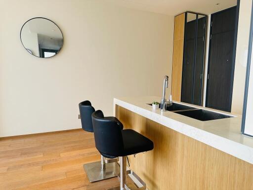 Modern kitchen with island, sink, and barstools