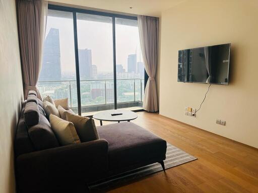 Modern living room with large window and city view