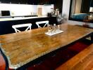 Spacious kitchen area with a large wooden dining table