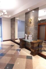 Building lobby with elevator and decorative items