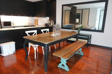 Modern dining area with wooden table and benches