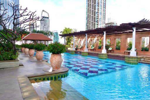 Outdoor swimming pool with adjacent seating area