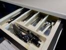 Open kitchen drawer with utensils