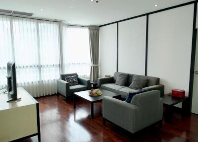 Modern living room with TV, sofas and wooden floor