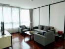 Modern living room with TV, sofas and wooden floor