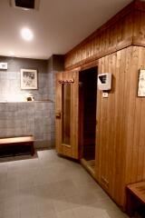 Interior view of a wooden sauna room with a bench