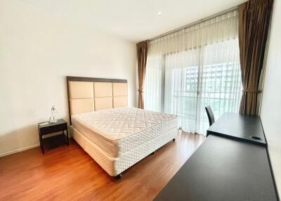 Bright and airy bedroom with large window and double bed