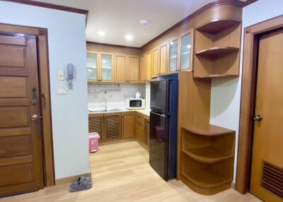 Modern kitchen with wooden cabinets and appliances