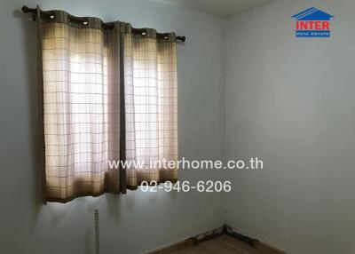 Small room with windows and curtains