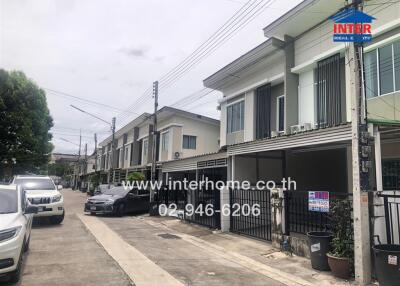 Front view of a residential building on a street