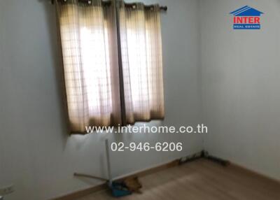 Bedroom with window and curtain