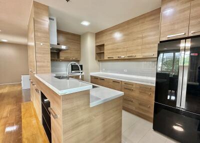 Modern kitchen with wooden cabinets and island