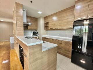 Modern kitchen with wooden cabinets and island