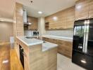 Modern kitchen with wooden cabinets and island