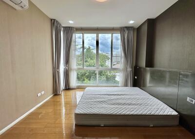 Spacious bedroom with a large window