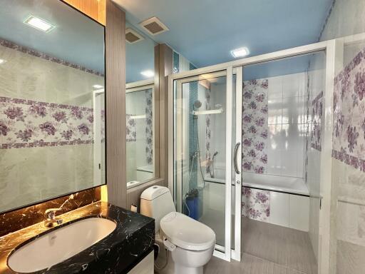 Modern bathroom with floral tile accents