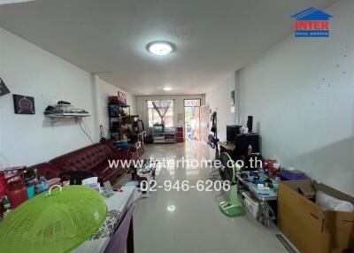 Living room with various belongings and furniture