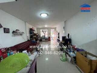 Living room with various belongings and furniture