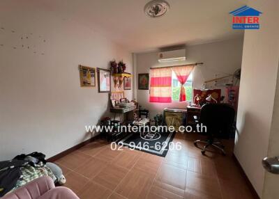 Bedroom with desk, window, and air conditioning