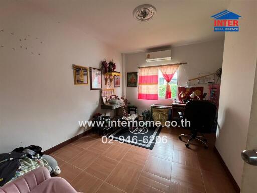 Bedroom with desk, window, and air conditioning