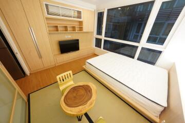 Modern bedroom with large windows