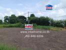 View of a vacant land plot with a real estate sign