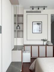 Modern bedroom with built-in storage and stylish decor