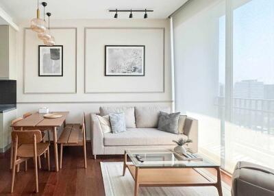 Modern living room with dining area, natural light, and contemporary furniture