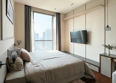 Modern bedroom with large window and city view