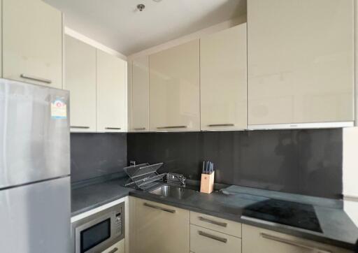 Modern kitchen with beige cabinets