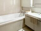 Modern bathroom with bathtub, vanity, and large mirror