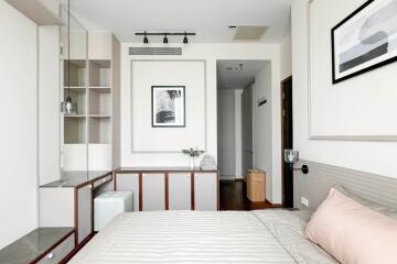 Modern bedroom with built-in shelves and minimalist decor