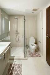 Modern bathroom with glass shower and toilet