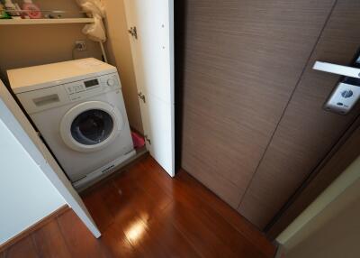 Compact laundry area with a washing machine