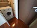 Compact laundry area with a washing machine