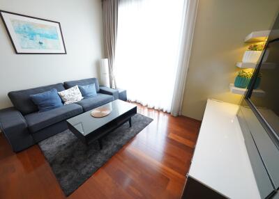 Modern living room with couch, coffee table, and entertainment unit