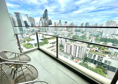 A balcony with a view of a city skyline