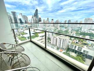 A balcony with a view of a city skyline