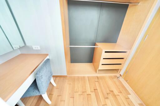 Bedroom with walk-in closet and dressing table