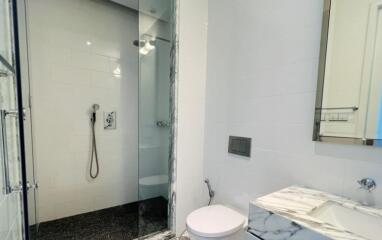 Modern bathroom with glass-enclosed shower