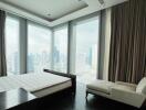 Modern bedroom with large windows and city view