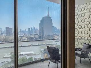 Modern living room with a view of the city skyline and river