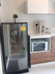 Modern kitchen with refrigerator and microwave