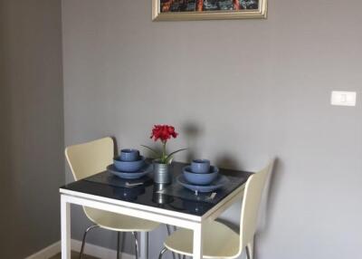 Small dining area with a table set for two