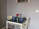 Small dining area with a table set for two