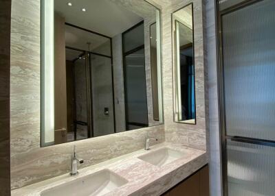 Modern bathroom with dual sinks and large mirrors