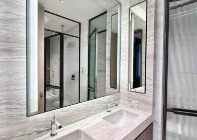 Modern bathroom with double sinks and large mirrors